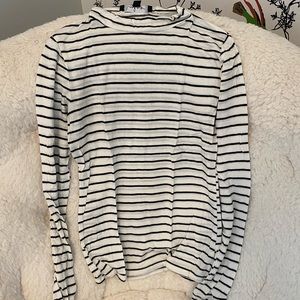 Tight black and white striped turtle neck